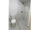 Modern shower with white marbled tile and a built-in bench, offering a spa-like experience at 3078 Parc Lorraine, Lithonia, GA 30038