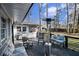 Back deck with an outdoor kitchen, comfortable seating, and a relaxing view of the backyard at 3331 Casa Linda Dr, Decatur, GA 30032