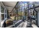 Back deck with an outdoor grill, comfortable seating, and lights for evening gatherings at 3331 Casa Linda Dr, Decatur, GA 30032