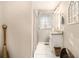 Bathroom featuring tile floors, a modern vanity, framed mirror, and a decorative arched window at 3331 Casa Linda Dr, Decatur, GA 30032