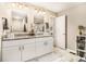 Bright bathroom with a double vanity, granite countertop, and tiled shower at 3331 Casa Linda Dr, Decatur, GA 30032
