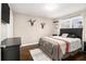 Cozy bedroom with a large bed, wooden floors, and lots of natural light at 3331 Casa Linda Dr, Decatur, GA 30032