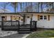 A cozy home's front entrance featuring a porch with seating, complemented by charming shutters and a 'WELCOME' sign at 3331 Casa Linda Dr, Decatur, GA 30032