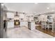 Modern kitchen with white cabinets, stone countertops, stainless appliances, and a view of the living room at 3331 Casa Linda Dr, Decatur, GA 30032