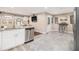 Stylish kitchen with stainless appliances, granite counters, bar seating, and access to additional rooms at 3331 Casa Linda Dr, Decatur, GA 30032