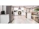 A spacious kitchen with white cabinets, stainless steel appliances, and an open floor plan at 3331 Casa Linda Dr, Decatur, GA 30032
