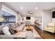 Well-lit living space with a comfortable sectional sofa and a seamless flow to the kitchen at 3331 Casa Linda Dr, Decatur, GA 30032