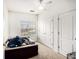 Cozy bedroom with a small window and two closets at 4809 Shae Ct, Powder Springs, GA 30127