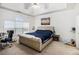 Spacious bedroom features a tray ceiling, soft natural light, and a peaceful, relaxing atmosphere at 4809 Shae Ct, Powder Springs, GA 30127