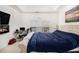 Spacious bedroom features a cozy bed, large window, and a fireplace with mounted TV at 4809 Shae Ct, Powder Springs, GA 30127