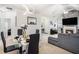 Elegant dining area with modern chandelier, seating for four, with a view to the fireplace at 4809 Shae Ct, Powder Springs, GA 30127