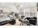 Bright home gym with large windows and workout equipment at 4809 Shae Ct, Powder Springs, GA 30127