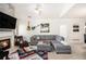 Bright living room offers modern furniture, fireplace, and leads to dining area and kitchen at 4809 Shae Ct, Powder Springs, GA 30127