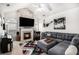Stylish living room with vaulted ceilings, fireplace, large screen TV, comfortable seating and piano at 4809 Shae Ct, Powder Springs, GA 30127