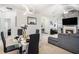 Bright living space combines living and dining, offering a fireplace, high ceilings, and neutral tones at 4809 Shae Ct, Powder Springs, GA 30127