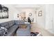Open-concept living space combining living and dining area, offering modern furnishings and lighting at 4809 Shae Ct, Powder Springs, GA 30127