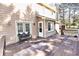 Backyard exterior featuring a wooden deck with a bench and French doors, creating an inviting outdoor living space at 4852 Gold Nugget Way, Sugar Hill, GA 30518
