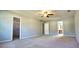 Large bedroom with ceiling fan, walk-in closet, and an ensuite bathroom at 4852 Gold Nugget Way, Sugar Hill, GA 30518