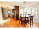 Eat-in kitchen featuring stainless steel appliances, dark cabinetry, and a sunlit window at 4852 Gold Nugget Way, Sugar Hill, GA 30518
