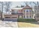 Charming two-story home with a two-car garage and well-maintained landscaping and neutral color palette at 4852 Gold Nugget Way, Sugar Hill, GA 30518