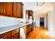Modern kitchen featuring stainless steel appliances, ample cabinetry, and hardwood floors at 4852 Gold Nugget Way, Sugar Hill, GA 30518
