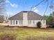 Expansive backyard featuring mature trees, meticulously maintained yard, and home exterior at 9135 Woodhaven Way, Mcdonough, GA 30253