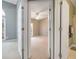 Inviting bedroom entrance with white doors offering a glimpse of the bedroom and bathroom at 9135 Woodhaven Way, Mcdonough, GA 30253