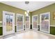 Bright breakfast nook with multiple windows, a door to the backyard, and stylish pendant lighting at 9135 Woodhaven Way, Mcdonough, GA 30253