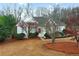 Charming single-Gathering home with a mix of brick and siding, complemented by lush landscaping at 9135 Woodhaven Way, Mcdonough, GA 30253