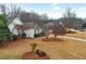 Charming home featuring a well-manicured front yard with mature trees and landscaping at 9135 Woodhaven Way, Mcdonough, GA 30253