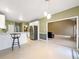Kitchen showcases an open layout, bar seating, stainless steel refrigerator, and easy access to the living room at 9135 Woodhaven Way, Mcdonough, GA 30253