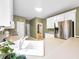 Kitchen featuring a large sink, white cabinets, a stainless steel refrigerator, and bright countertops at 9135 Woodhaven Way, Mcdonough, GA 30253