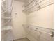 A walk-in closet with multiple shelves for organization and storage at 9135 Woodhaven Way, Mcdonough, GA 30253