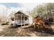 Charming home featuring a spacious backyard with a wooden playset, ideal for Gathering fun and outdoor activities at 31 Wyngate Ct, Dallas, GA 30157
