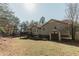 Backyard showcasing a deck and storage shed, offering space for outdoor living and storage solutions at 31 Wyngate Ct, Dallas, GA 30157
