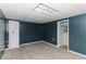 Finished basement with blue walls and gray carpet at 31 Wyngate Ct, Dallas, GA 30157