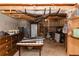 Unfinished basement with exposed rafters, concrete walls and a dirt floor at 31 Wyngate Ct, Dallas, GA 30157