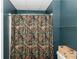 Bathroom with camouflage shower curtain at 31 Wyngate Ct, Dallas, GA 30157