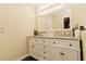 Bathroom featuring a double vanity with granite countertops and a large mirror at 31 Wyngate Ct, Dallas, GA 30157