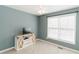Cozy bedroom with fresh paint, new carpet, and a charming TV stand at 31 Wyngate Ct, Dallas, GA 30157