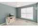 Cozy bedroom with fresh paint, new carpet, and a charming TV stand at 31 Wyngate Ct, Dallas, GA 30157