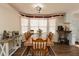 Traditional dining room featuring a large wooden table with seating for eight at 31 Wyngate Ct, Dallas, GA 30157