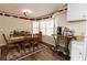 Dining room features wood table, chairs, natural light, and access to a convenient kitchenette at 31 Wyngate Ct, Dallas, GA 30157