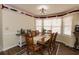 Traditional dining room featuring a large wooden table with seating for eight at 31 Wyngate Ct, Dallas, GA 30157