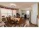 Dining room with wood furnishings and access to kitchenette, perfect for Gathering meals and entertaining at 31 Wyngate Ct, Dallas, GA 30157