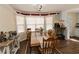 Traditional dining room featuring a large wooden table with seating for eight at 31 Wyngate Ct, Dallas, GA 30157