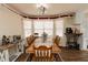 Traditional dining room featuring a large wooden table with seating for eight at 31 Wyngate Ct, Dallas, GA 30157