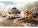 Charming home featuring a spacious backyard with a wooden playset, ideal for Gathering fun and outdoor activities at 31 Wyngate Ct, Dallas, GA 30157