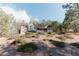 Serene home exterior with a view of lush landscaping and mature trees, creating a peaceful setting at 31 Wyngate Ct, Dallas, GA 30157