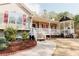 Inviting one-story home with a charming front porch and gazebo, perfect for relaxing and entertaining guests at 31 Wyngate Ct, Dallas, GA 30157